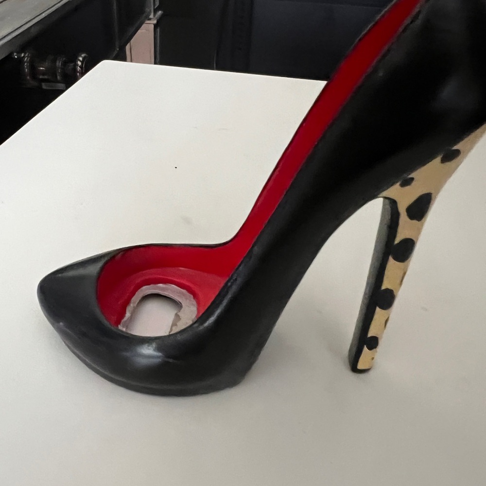 High heeled bottle opener